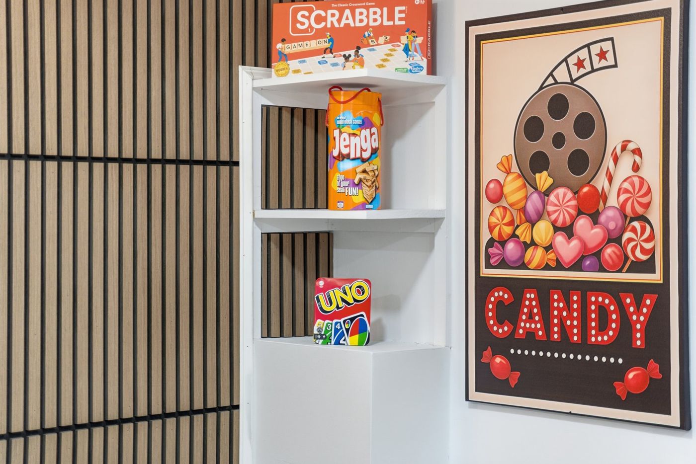 Board games and movie-theater decor in a game room