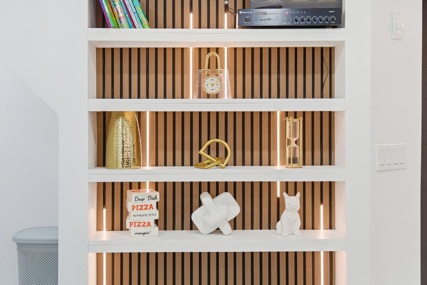 Styled shelf detail in an Airbnb